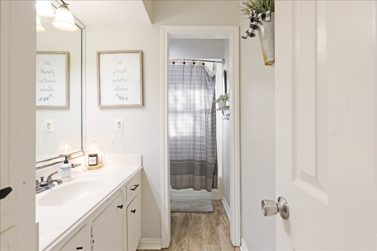 3809 Wingtail Way Pearland, TX 77584 - Photo 16 of 29 a bathroom with a shower sink and mirror
