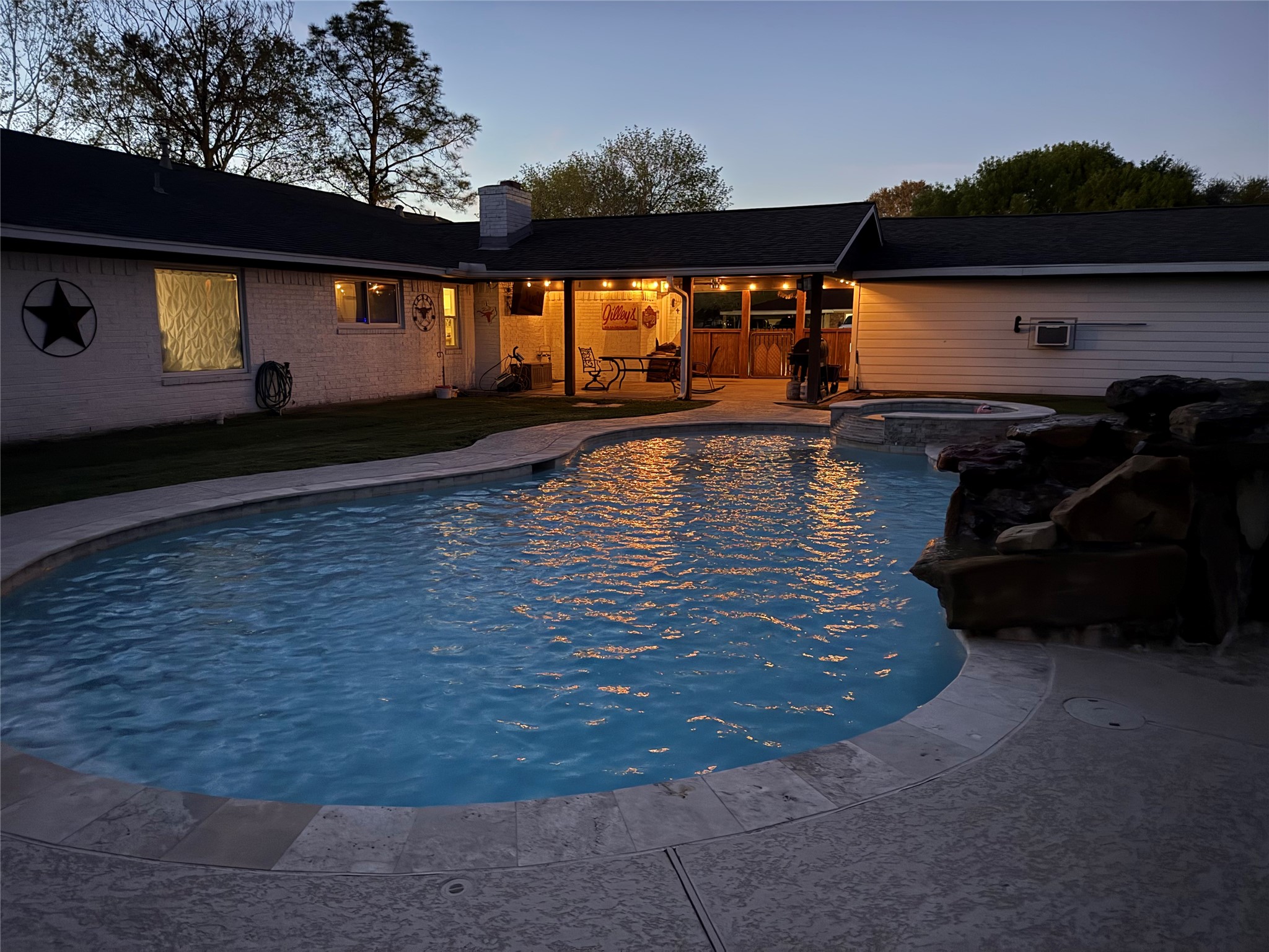 3809 Wingtail Way Pearland, TX 77584 - Photo 22 of 29 a view of swimming pool with outdoor seating and plants