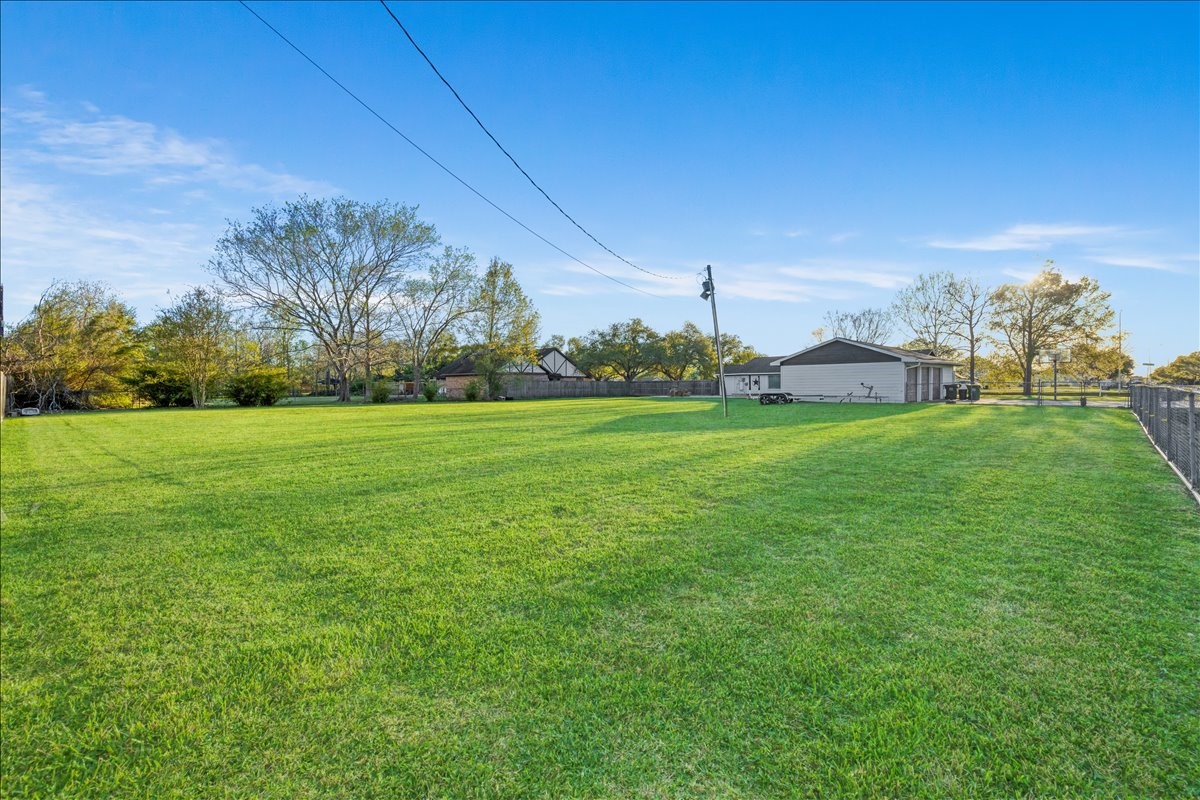 3809 Wingtail Way Pearland, TX 77584 - Photo 26 of 29 a view of a field of grass and trees