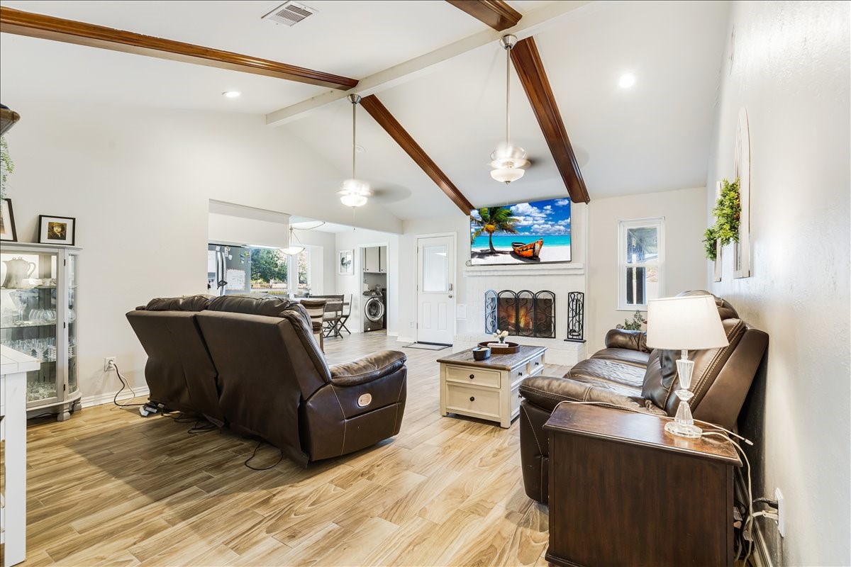 3809 Wingtail Way Pearland, TX 77584 - Photo 8 of 29 a living room with furniture and a fireplace
