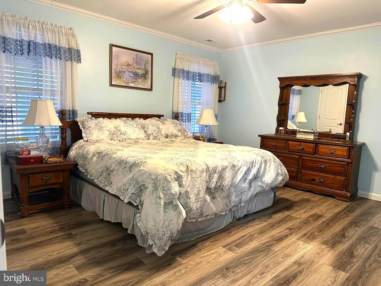 24266 Fox Run Seaford, DE 19973 - Photo 18 of 50 a bedroom with a bed and a dresser