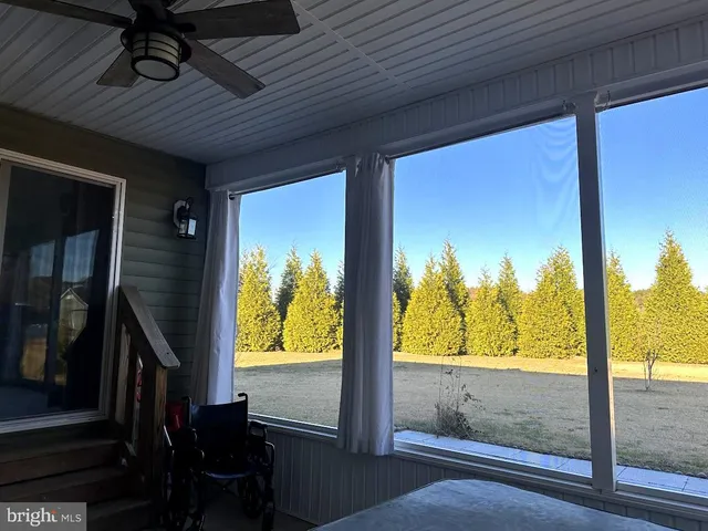 a view of a porch with wooden floor