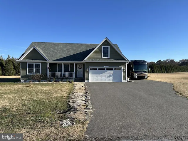 a front view of a house with yard