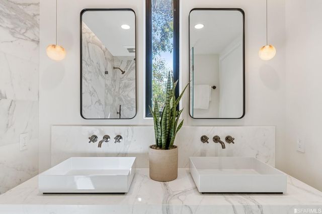 a bathroom with sink and mirror