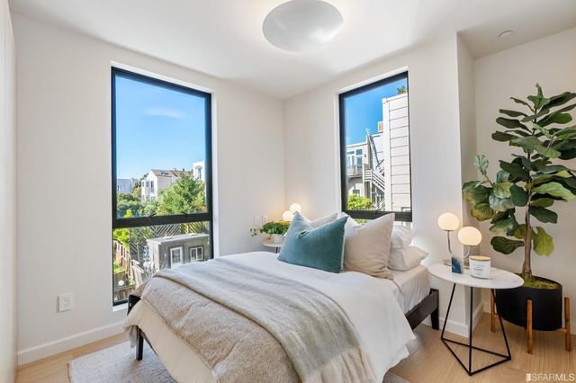 a bedroom with a bed and a table