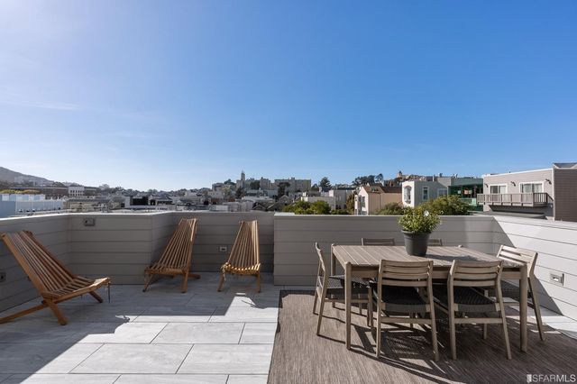 a view of a terrace with furniture