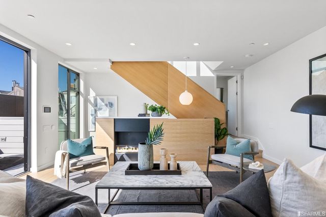 a living room with furniture and a table