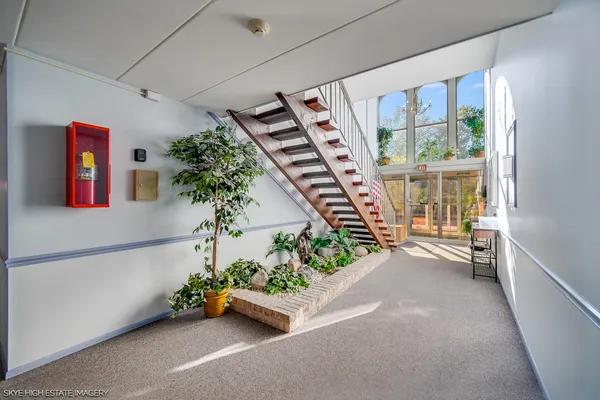 an entryway with flower pot