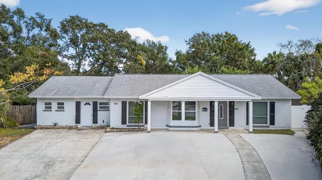 front view of a house with a garden