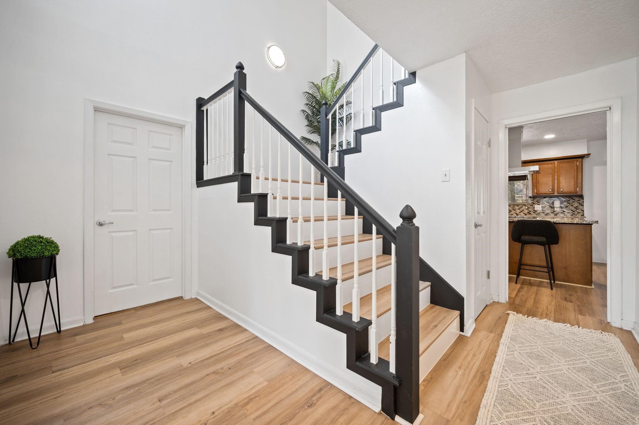 14907 Oak Bluff Court Houston, TX 77070 - Photo 4 of 19 Spacious entry foyer with soaring ceilings and updated staircase.