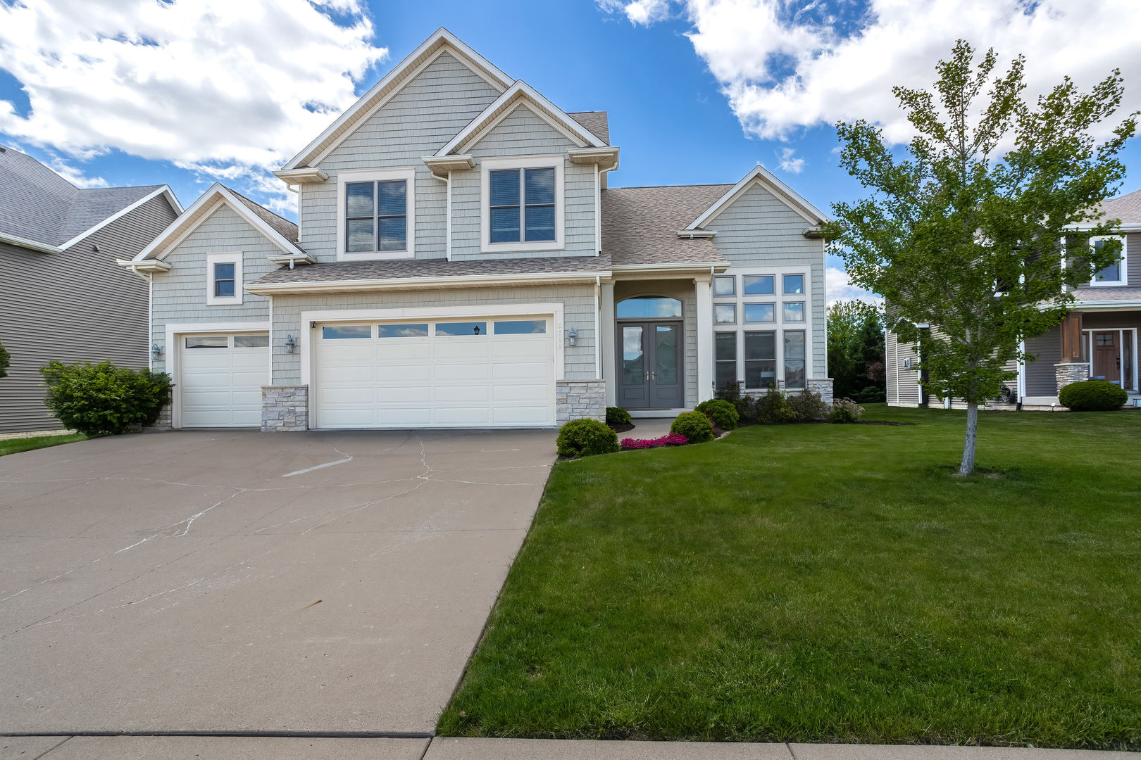 5700 Emily Road Bettendorf, IA 52722 - Photo 56 of 58 a front view of a house with a yard