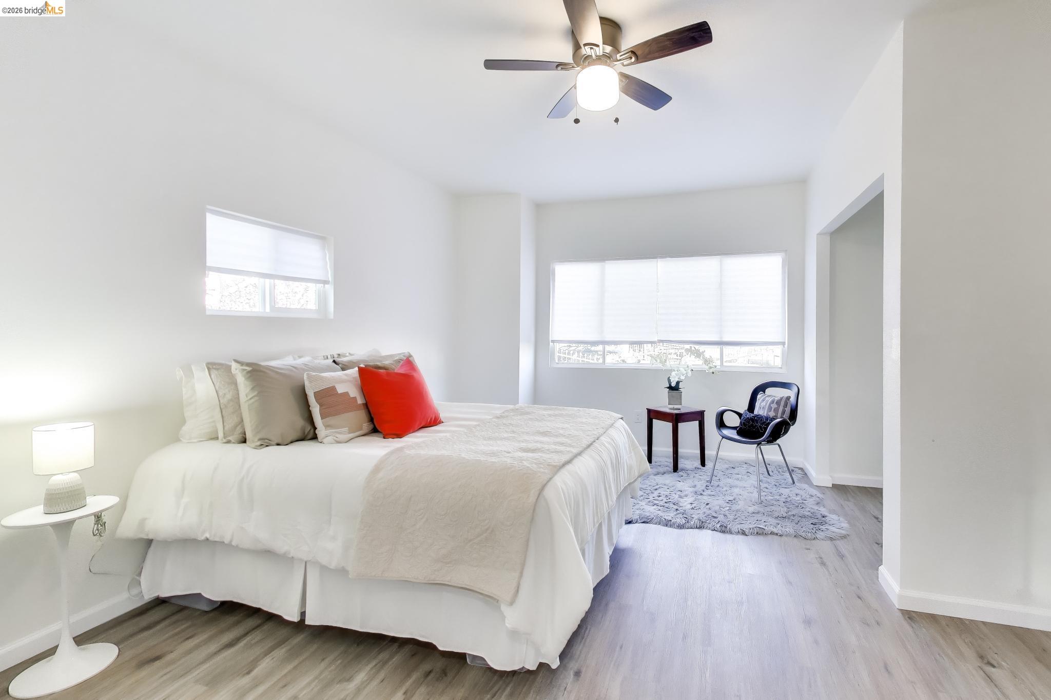 1978 Rosedale Avenue Oakland, CA 94601 - Photo 15 of 36 a bedroom with a bed and a chandelier