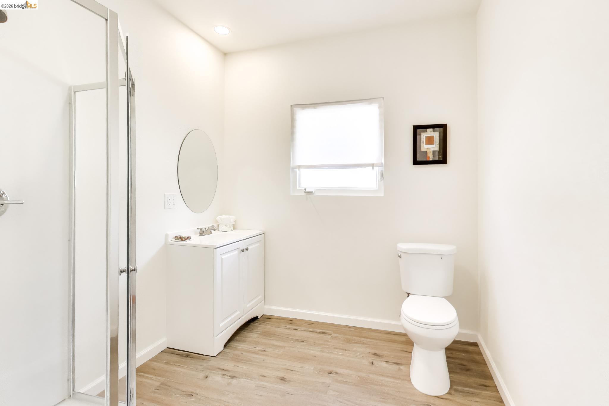 1978 Rosedale Avenue Oakland, CA 94601 - Photo 23 of 36 a bathroom with a toilet a sink and mirror