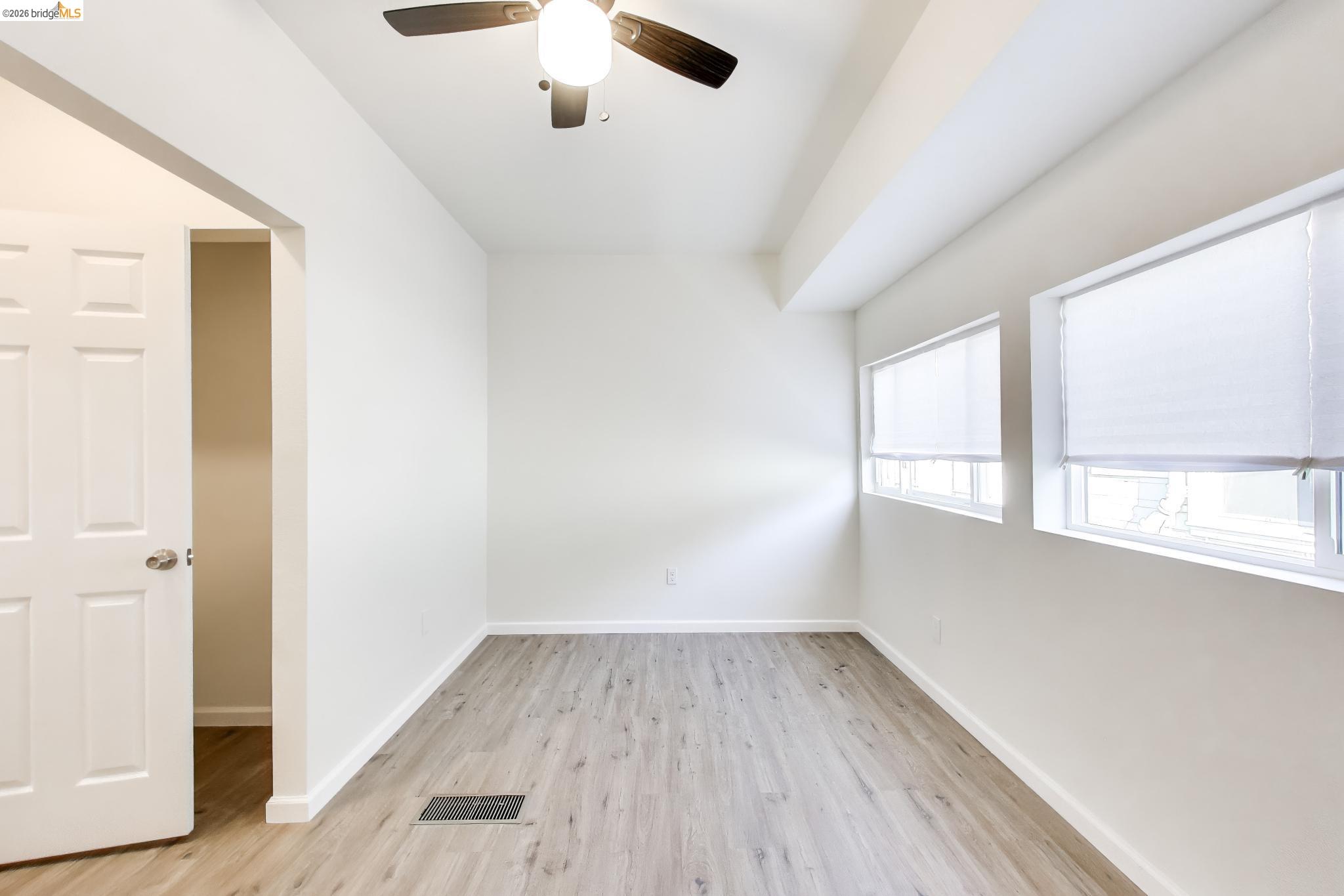 1978 Rosedale Avenue Oakland, CA 94601 - Photo 24 of 36 wooden floor in an empty room with a window
