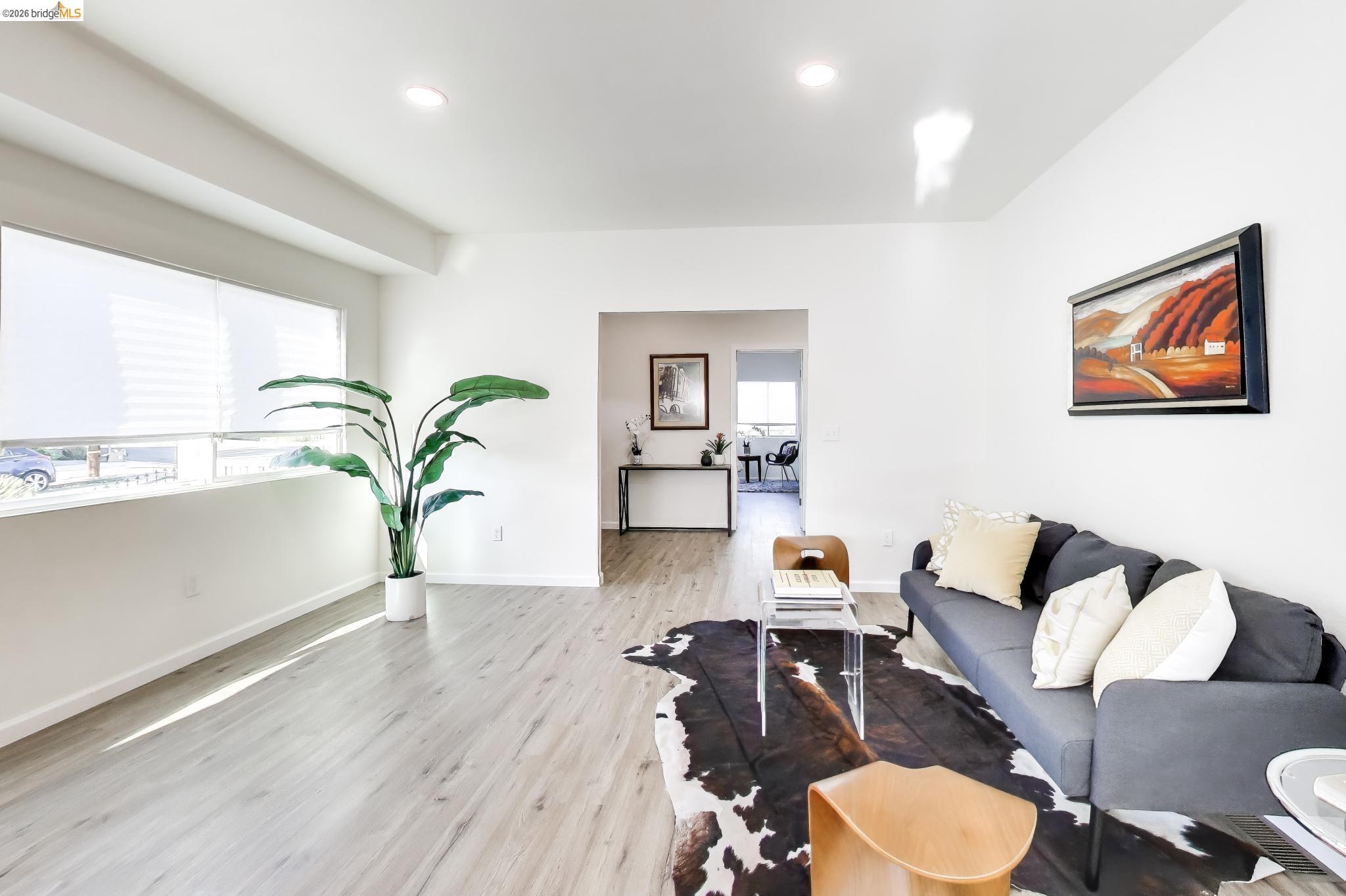 1978 Rosedale Avenue Oakland, CA 94601 - Photo 5 of 36 a living room with furniture and a wooden floor