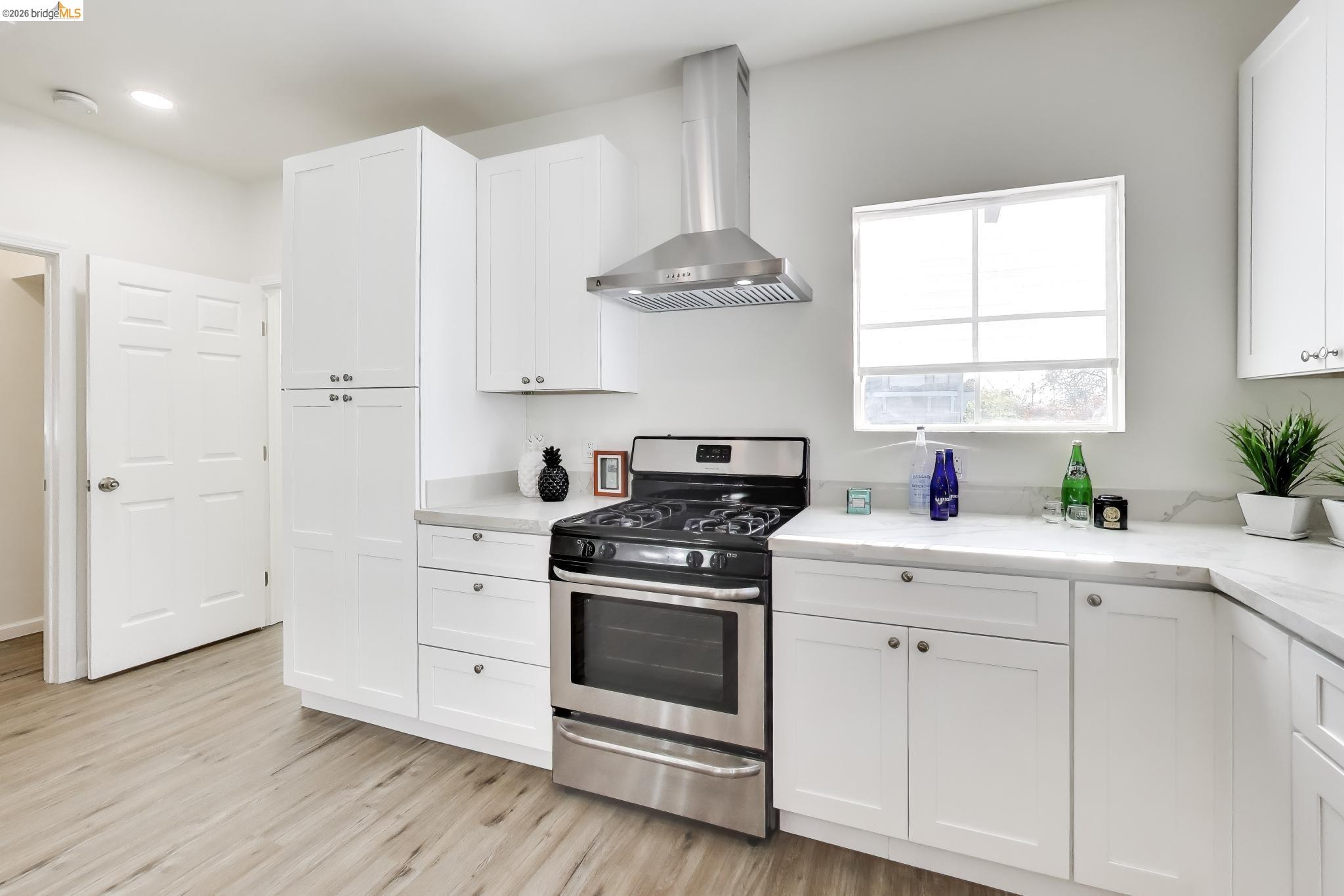 1978 Rosedale Avenue Oakland, CA 94601 - Photo 8 of 36 a kitchen with a stove a sink and a window