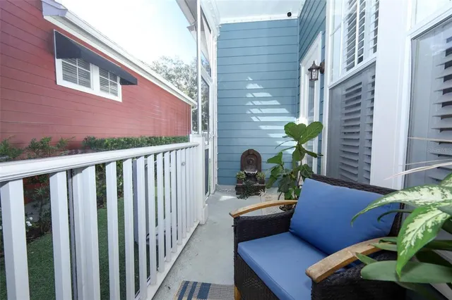 a balcony view with a potted plant