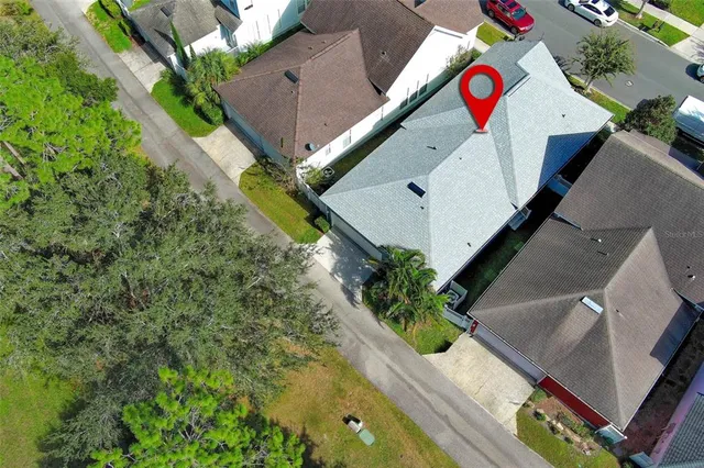 an aerial view of a house with a garden