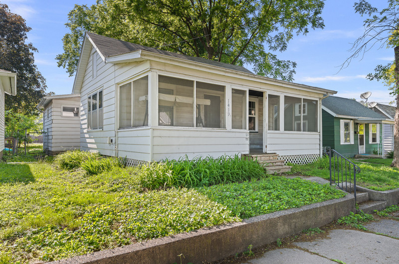 1419 17th Street Moline, IL 61265 - Photo 2 of 28 front view of a house with a yard