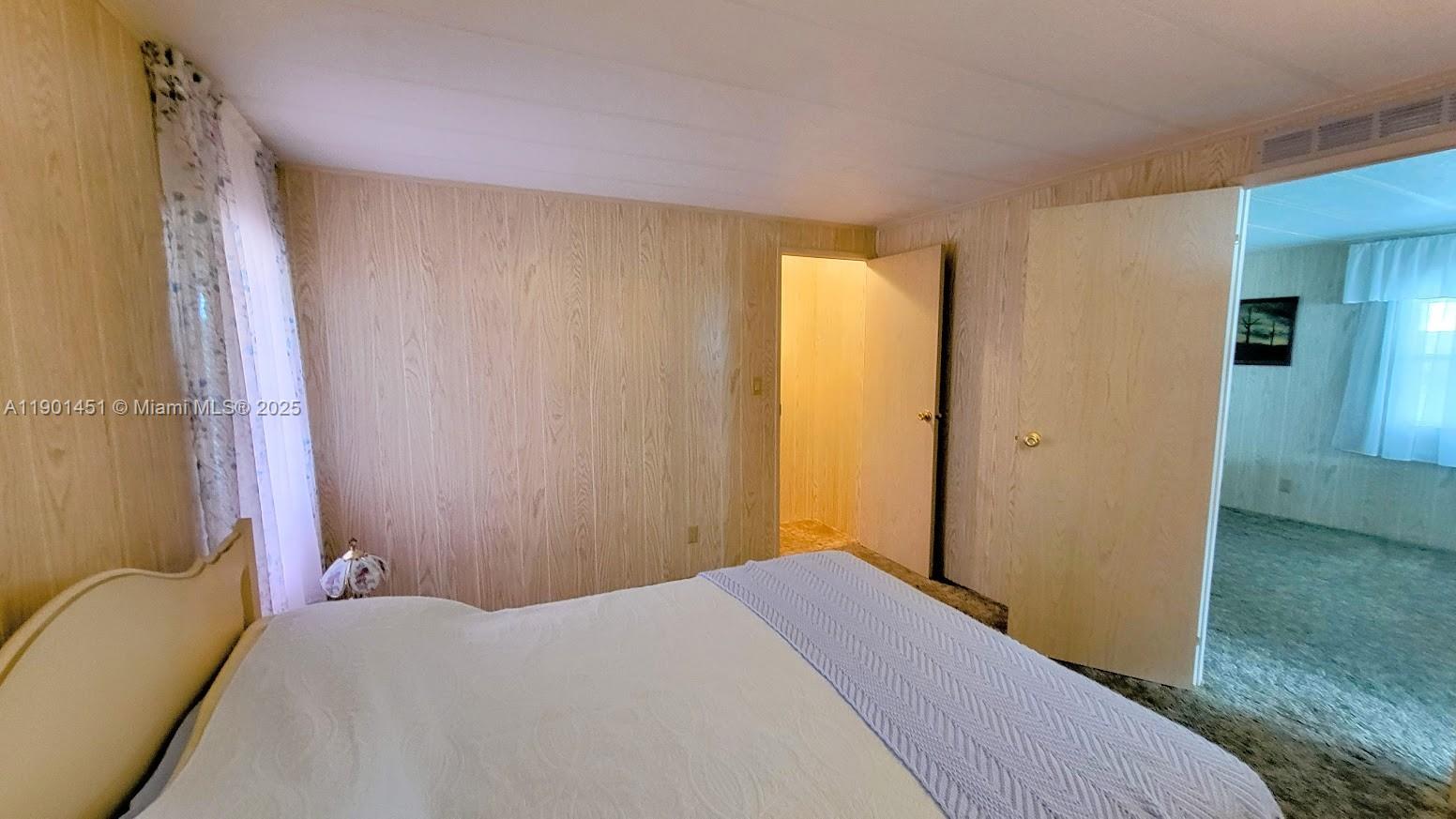 10 Hay Alva, FL 33920 - Photo 2 of 14 a bedroom with a bed and a chandelier