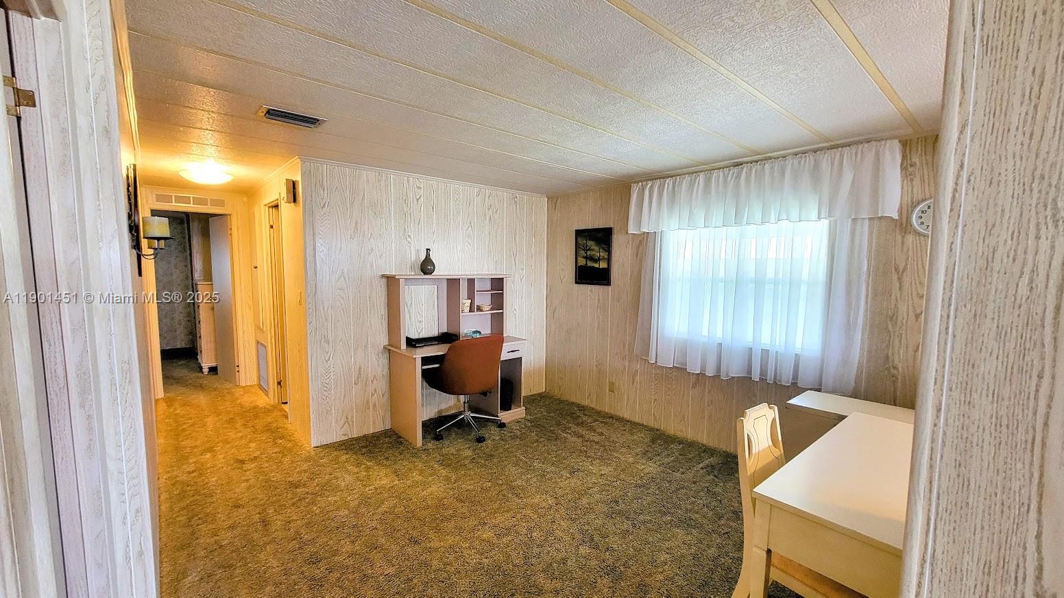 10 Hay Alva, FL 33920 - Photo 8 of 14 a view of a livingroom with workspace and a window