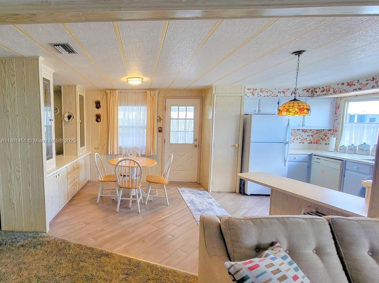 10 Hay Alva, FL 33920 - Photo 9 of 14 a living room with furniture dining table and wooden floors