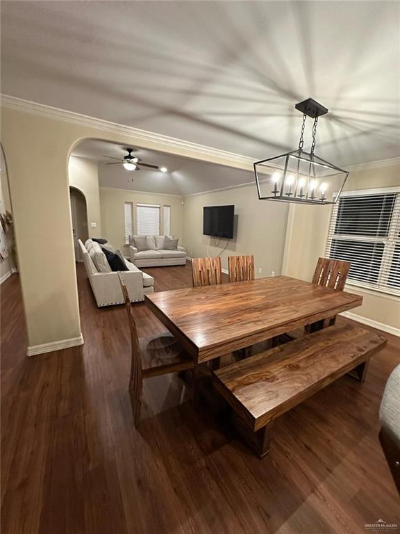 4608 Robin Avenue McAllen, TX 78504 - Photo 5 of 12 Dining area featuring a contemporary geometric pendant light, wood-finish flooring, and crown molding
