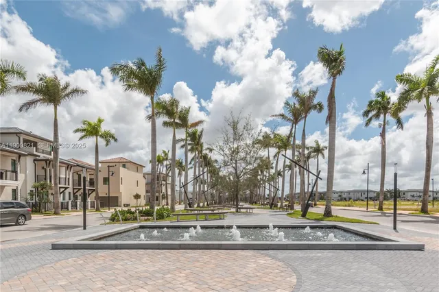 a view of a city with palm trees