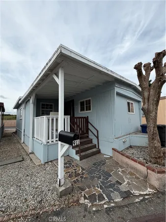 a front view of a house with stairs
