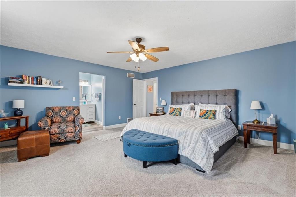 2356 Big Rock Road Allison Park, PA 15101 - Photo 15 of 31 a bedroom with a bed and a chandelier