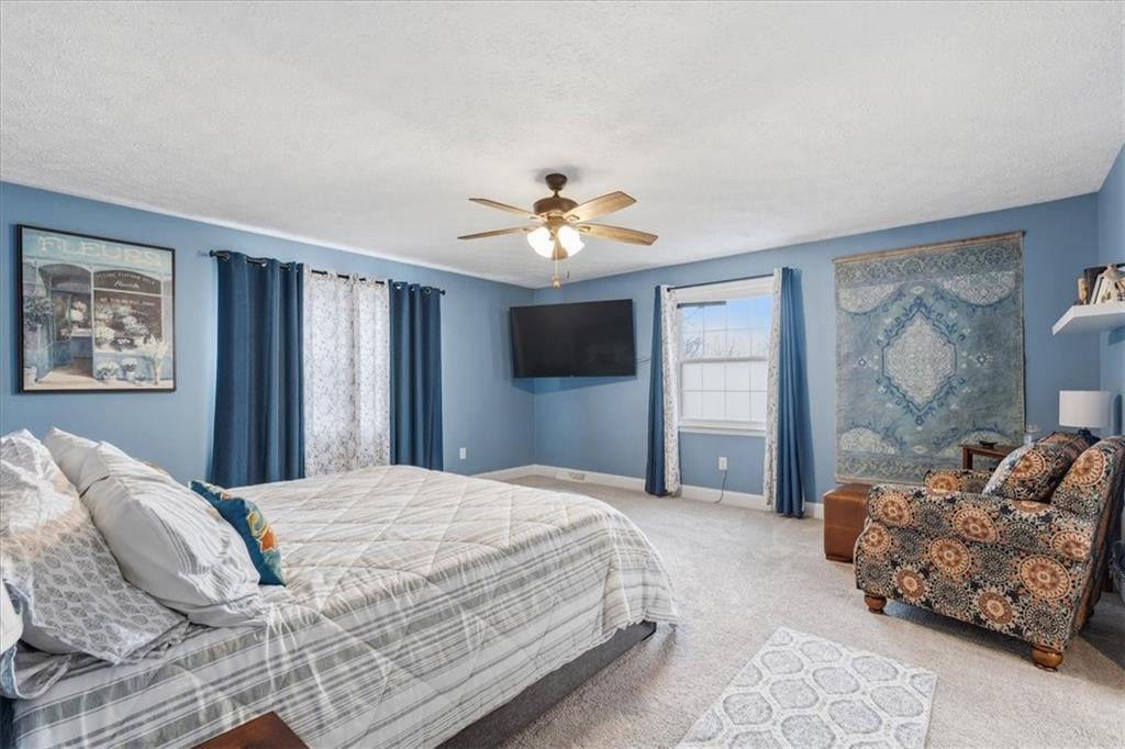 2356 Big Rock Road Allison Park, PA 15101 - Photo 16 of 31 a spacious bedroom with a bed and a chandelier