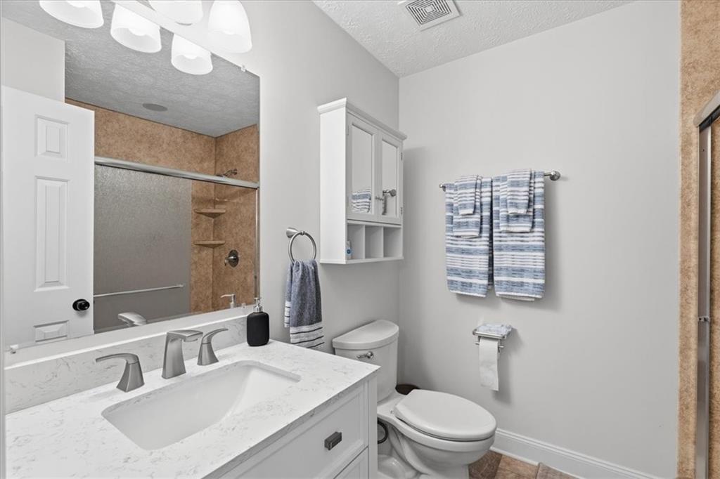 2356 Big Rock Road Allison Park, PA 15101 - Photo 20 of 31 a bathroom with a sink a toilet and shower