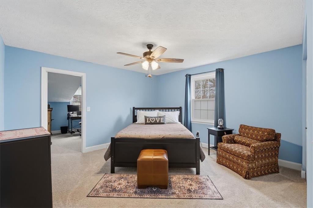 2356 Big Rock Road Allison Park, PA 15101 - Photo 22 of 31 a bed room with furniture and a chandelier