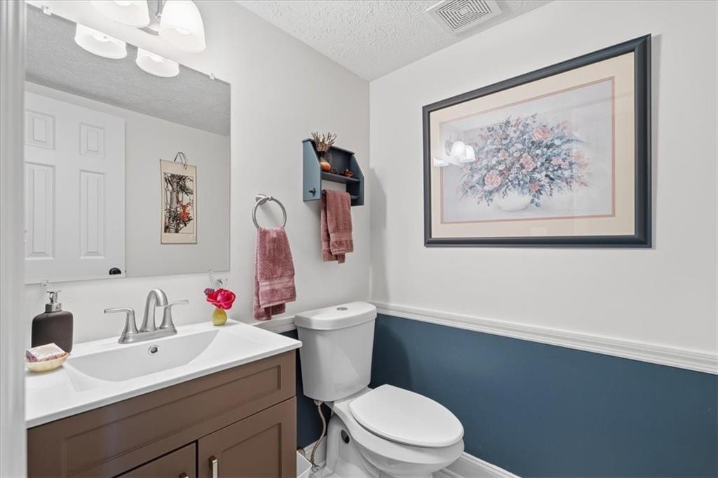 2356 Big Rock Road Allison Park, PA 15101 - Photo 26 of 31 a bathroom with a sink vanity mirror and toilet