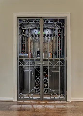 a living room with furniture a wooden floor and next to a window