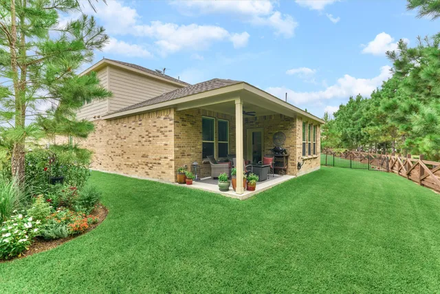a backyard of a house with outdoor seating