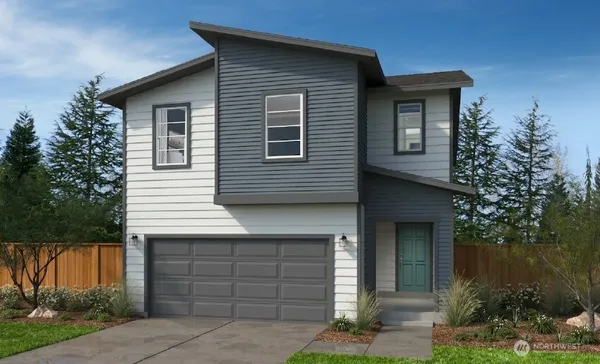 a front view of a house with a garage