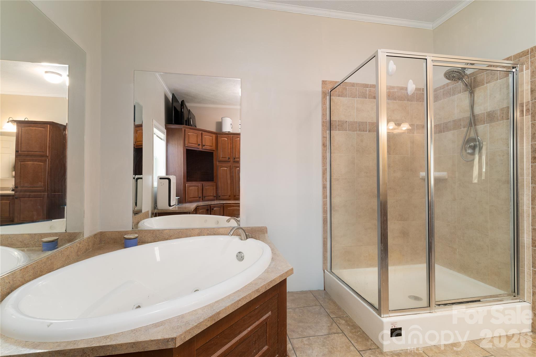 296 Stillwater Road Troutman, NC 28166 - Photo 27 of 33 a bathroom with a bathtub and a shower