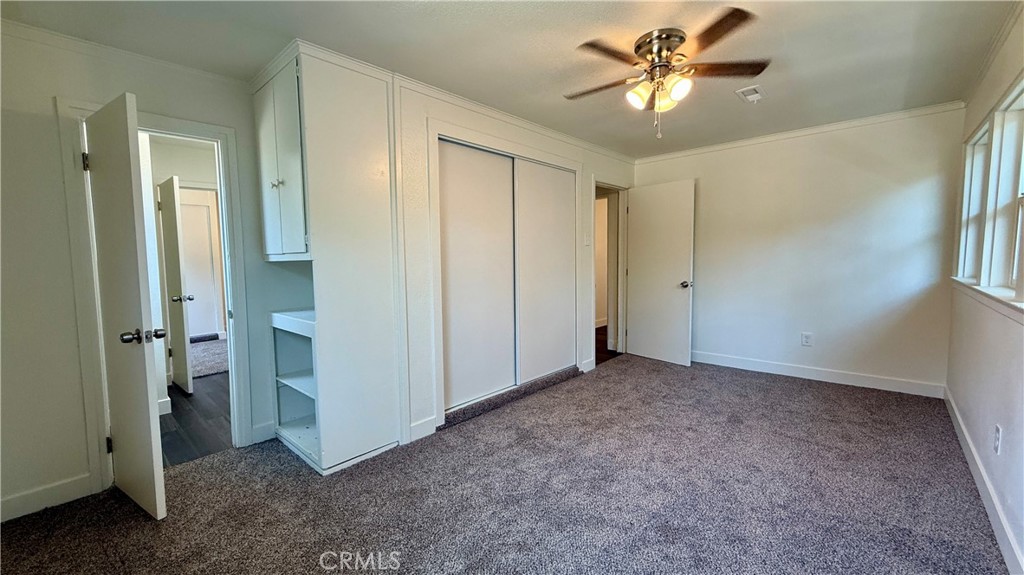 4542 Bandini Avenue Riverside, CA 92506 - Photo 14 of 22 an empty room with closet and a chandelier fan