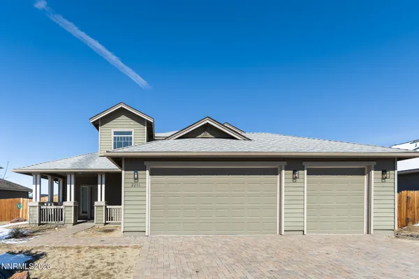 a front view of a house with a garage