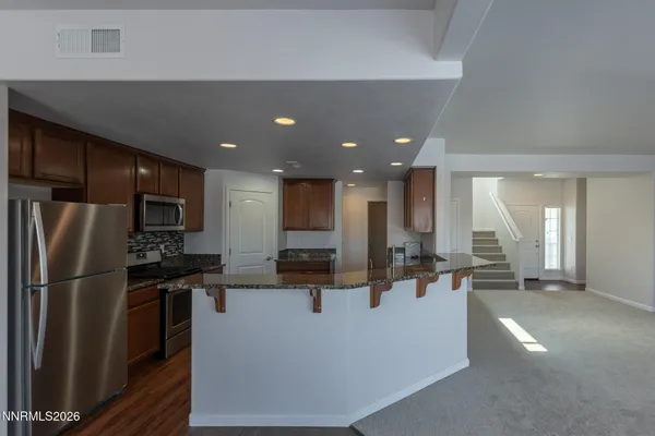a view of a living room with chairs