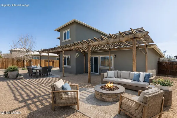 a view of a patio with couches table and chairs with potted plants