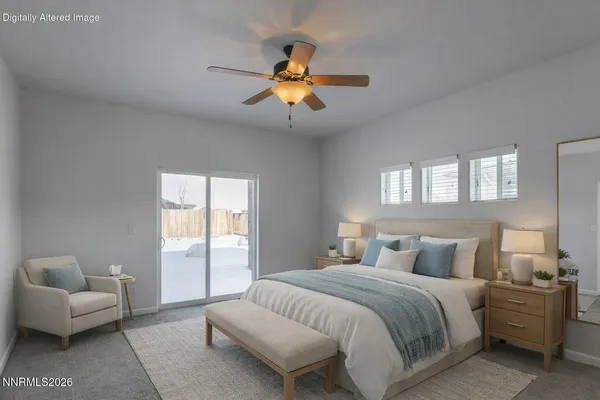 a bedroom with a large bed and a couch