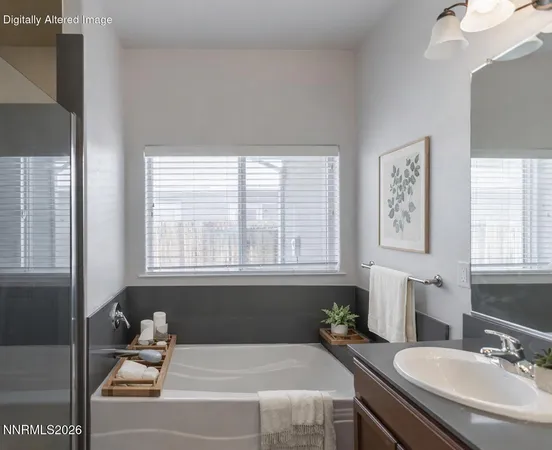 a bathroom with a tub sink and mirror