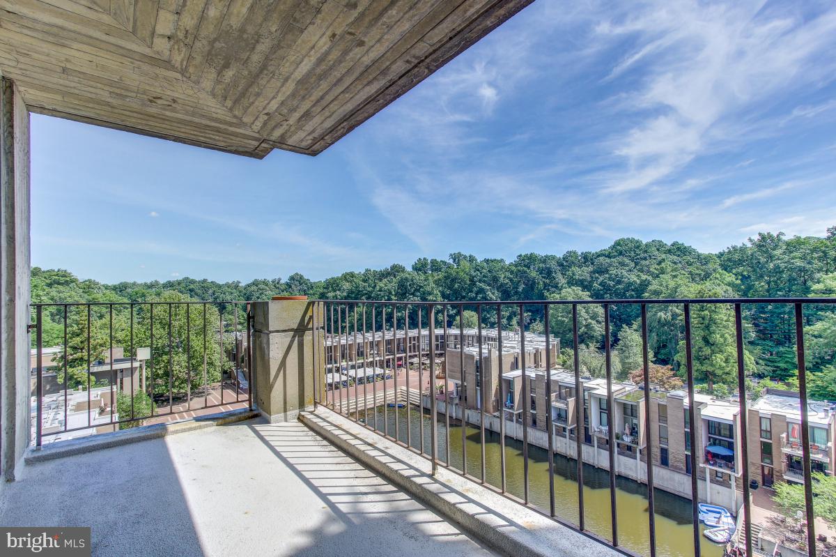 11400 Washington Plaza West, Unit 804 Reston, VA 20190 - Photo 14 of 32 Huge covered concrete balcony overlooks Lake Anne