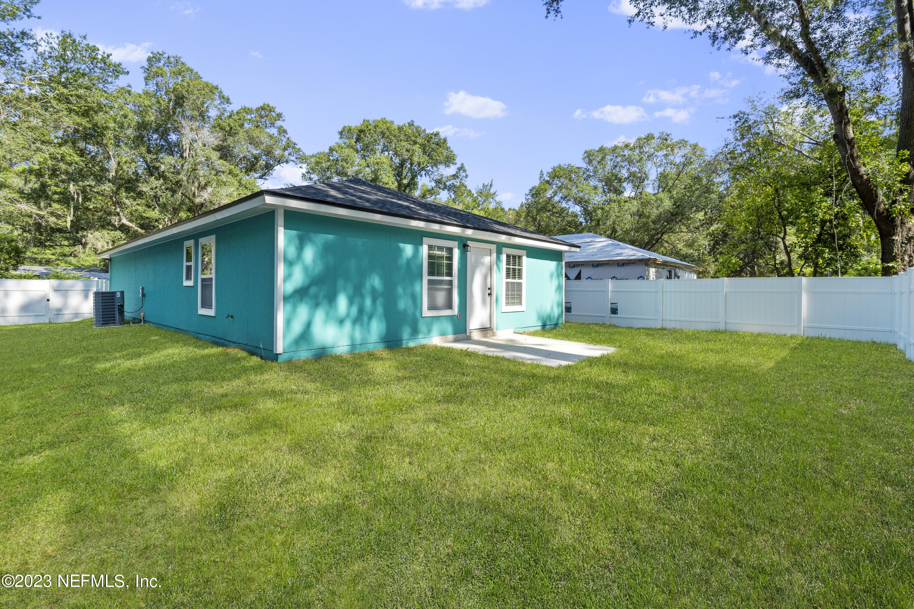 221 Monterey Boulevard Baldwin, FL 32234 - Photo 16 of 18 a front view of house with yard and green space