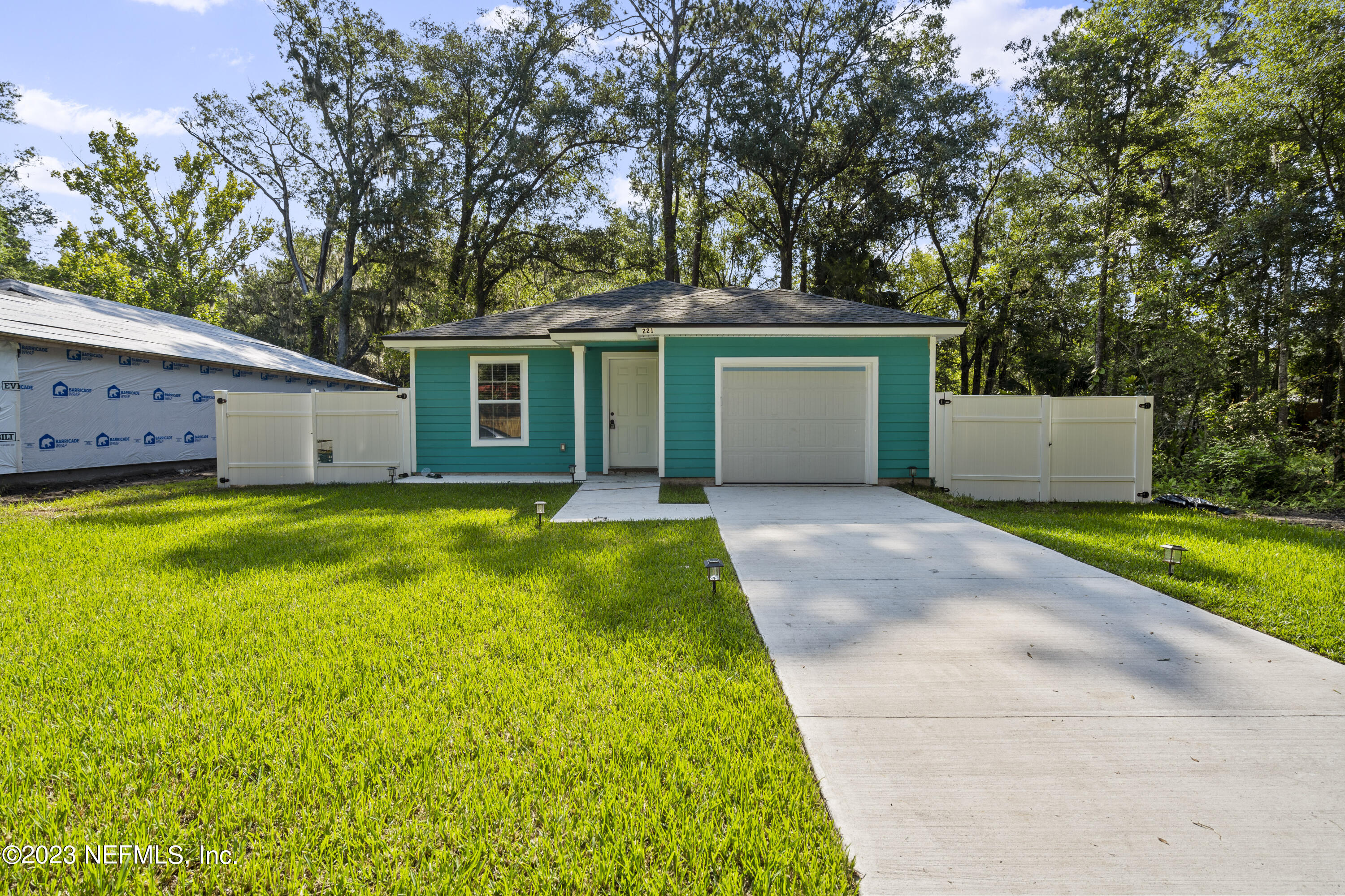 221 Monterey Boulevard Baldwin, FL 32234 - Photo 4 of 18 a view of a house with backyard and a tree