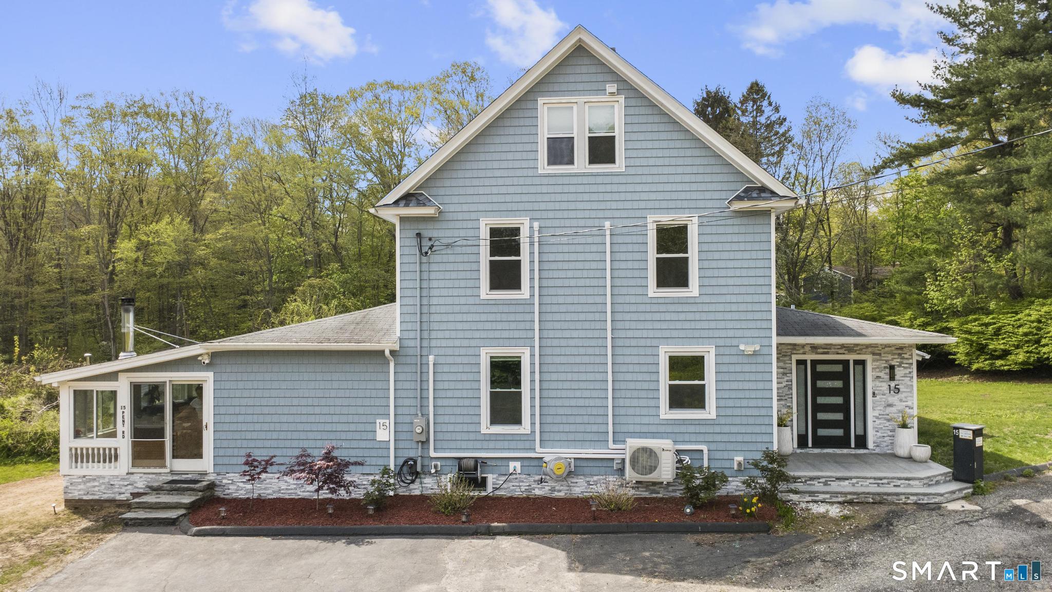 15 Pent Road Deep River, CT 06417 - Photo 6 of 36 a front view of a house with a yard and garage