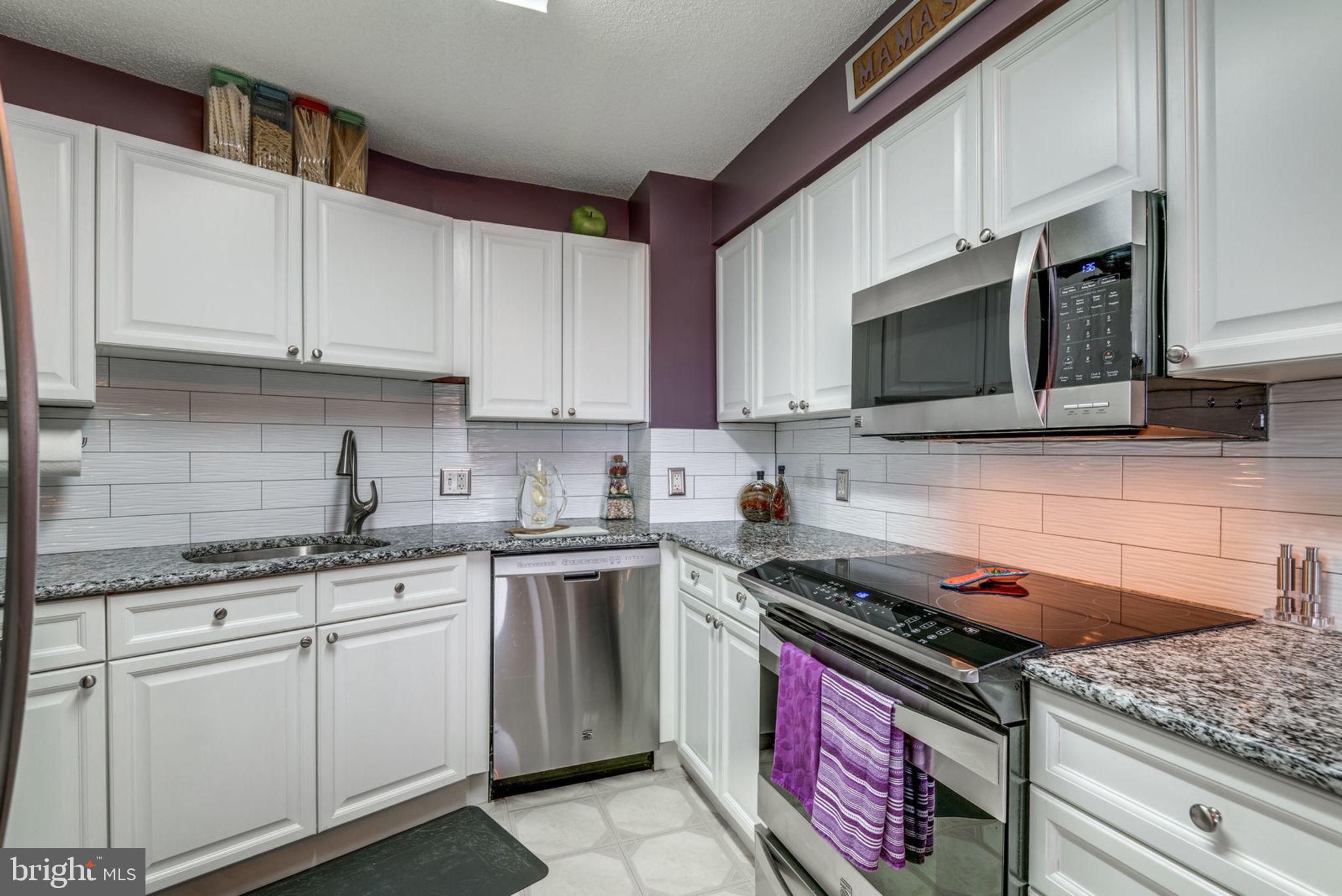 19385 Cypress Ridge Terrace, Unit 721 Leesburg, VA 20176 - Photo 1 of 26 Updated kitchen with granite and stainless