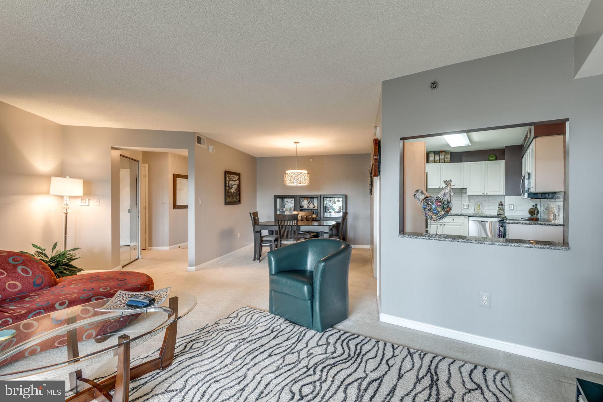 19385 Cypress Ridge Terrace, Unit 721 Leesburg, VA 20176 - Photo 13 of 26 Large cutout from kitchen to living area